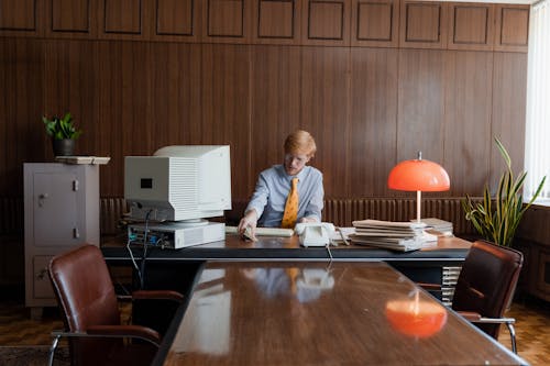 Free A Man Sitting in the Office Stock Photo