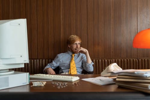 A Man Thinking in the Office