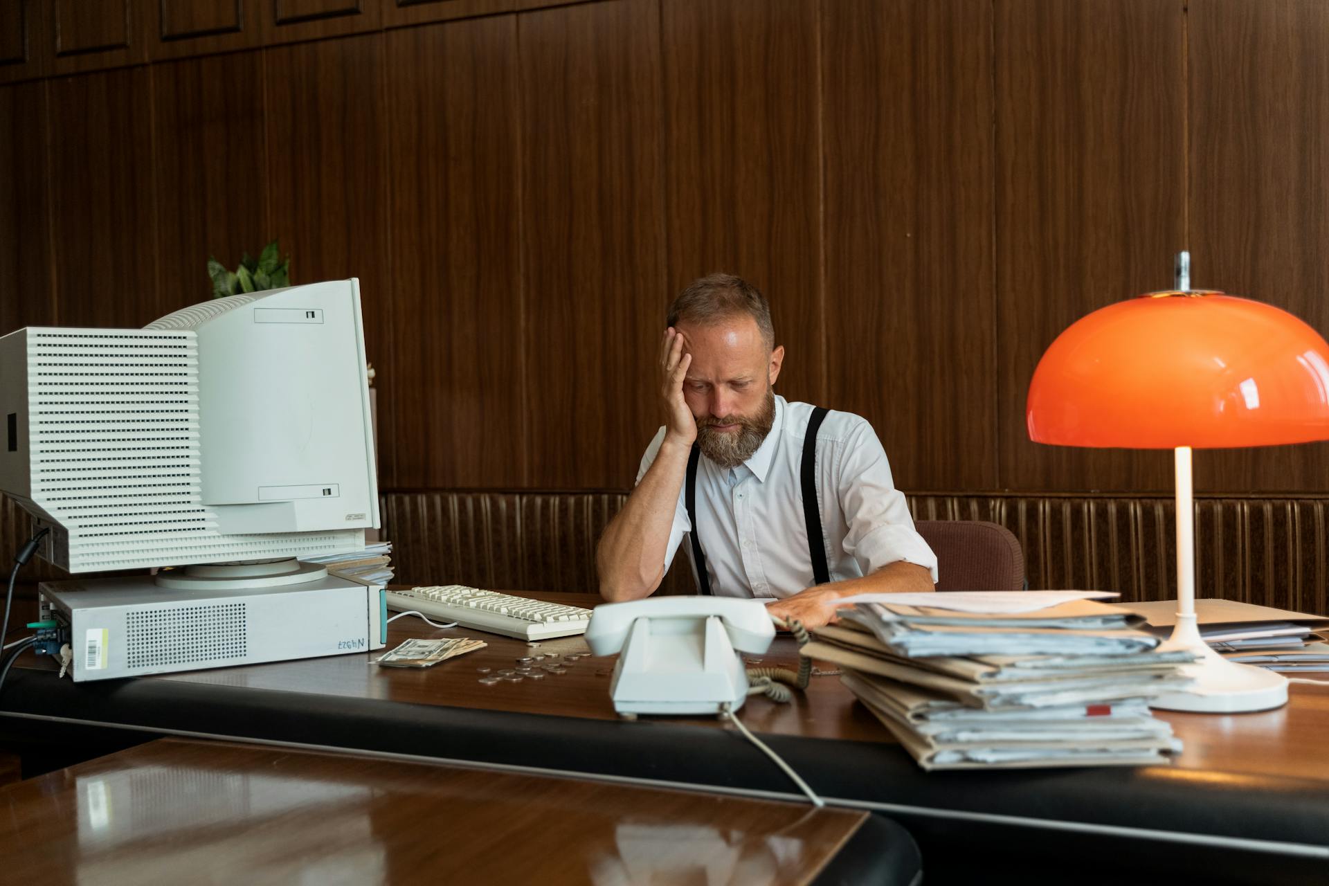 A Problematic Businessman with His Hand on His Face