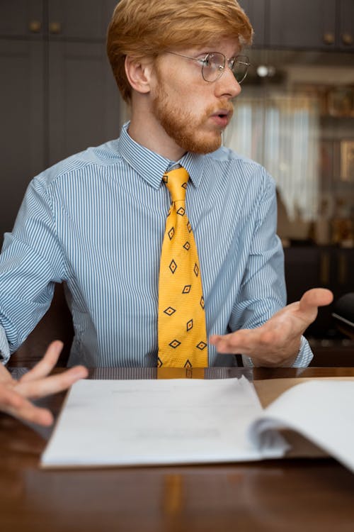 Photograph of a Man with a Yellow Necktie Speaking