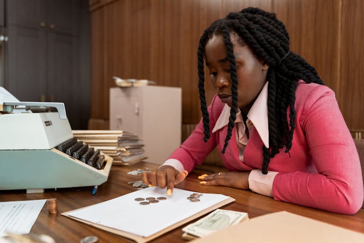 A Woman Counting Coins