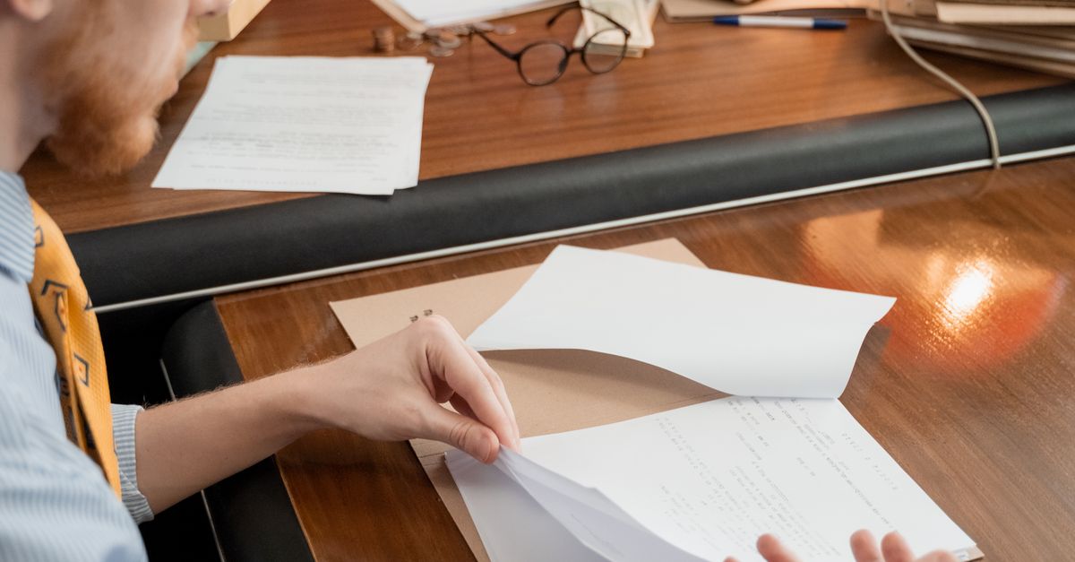 Readind Documents A Man Reading Documents · Free Stock Photo