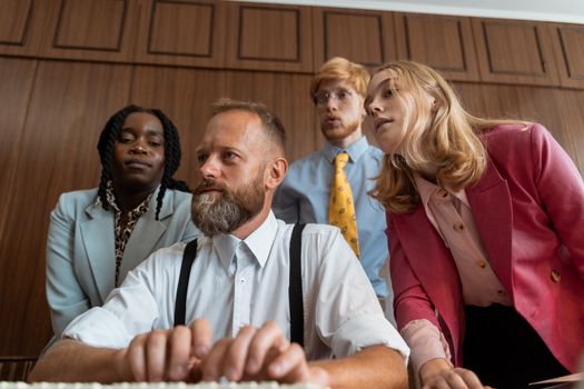 A diverse group of colleagues collaborating in an office environment.