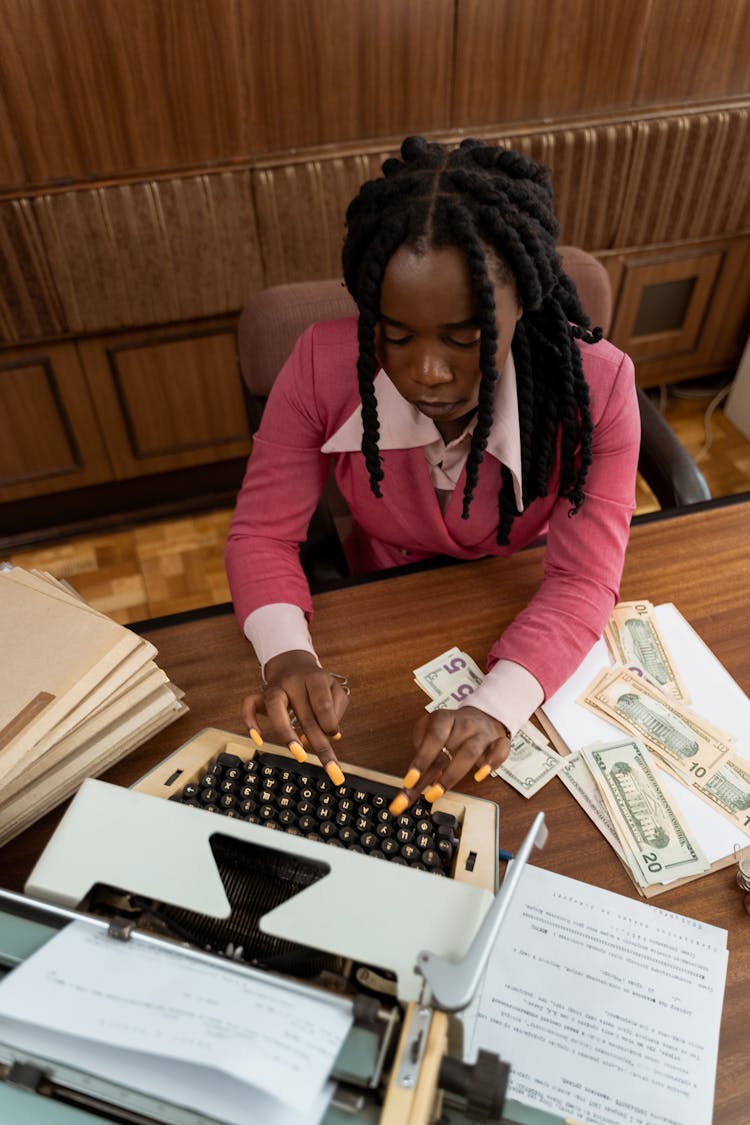 A Woman Using Typewriter 