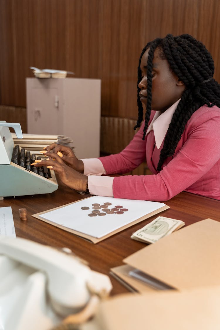 A Woman Using A Typewriter