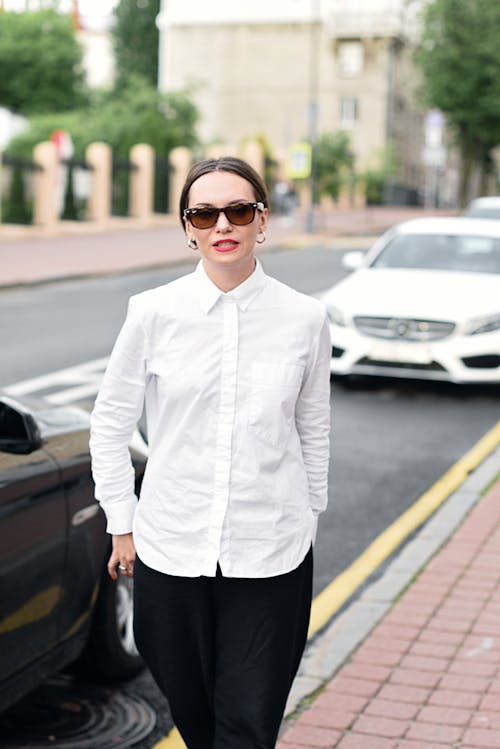 A Beautiful Woman in White Long Sleeve Shirt and Sunglasses