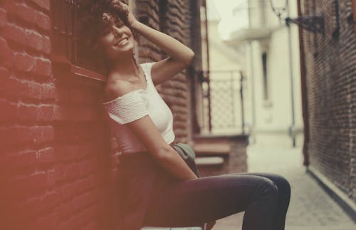 Free Woman Wearing White Off-shoulder Shirt and Blue Denim Jens Stock Photo