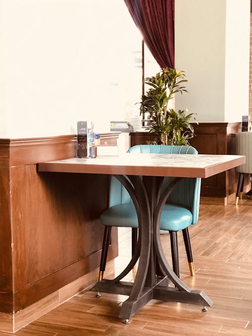 Blue Chair and Table Inside a Cafe