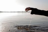 Water Dripping From a Person's Hand