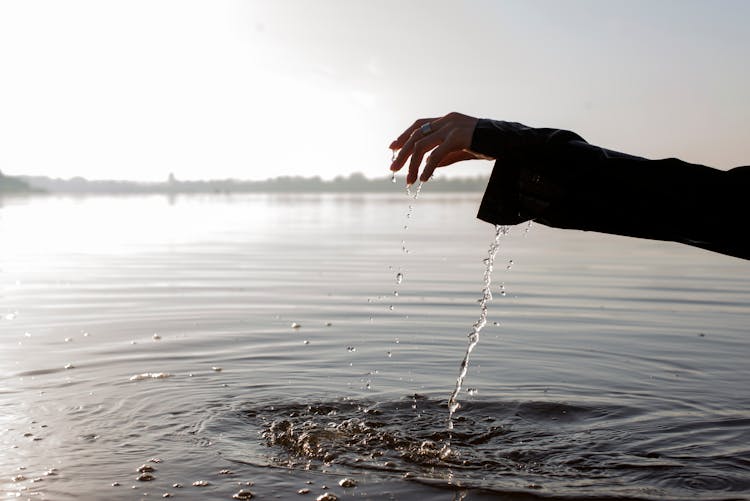 Water Dripping From A Person's Hand 