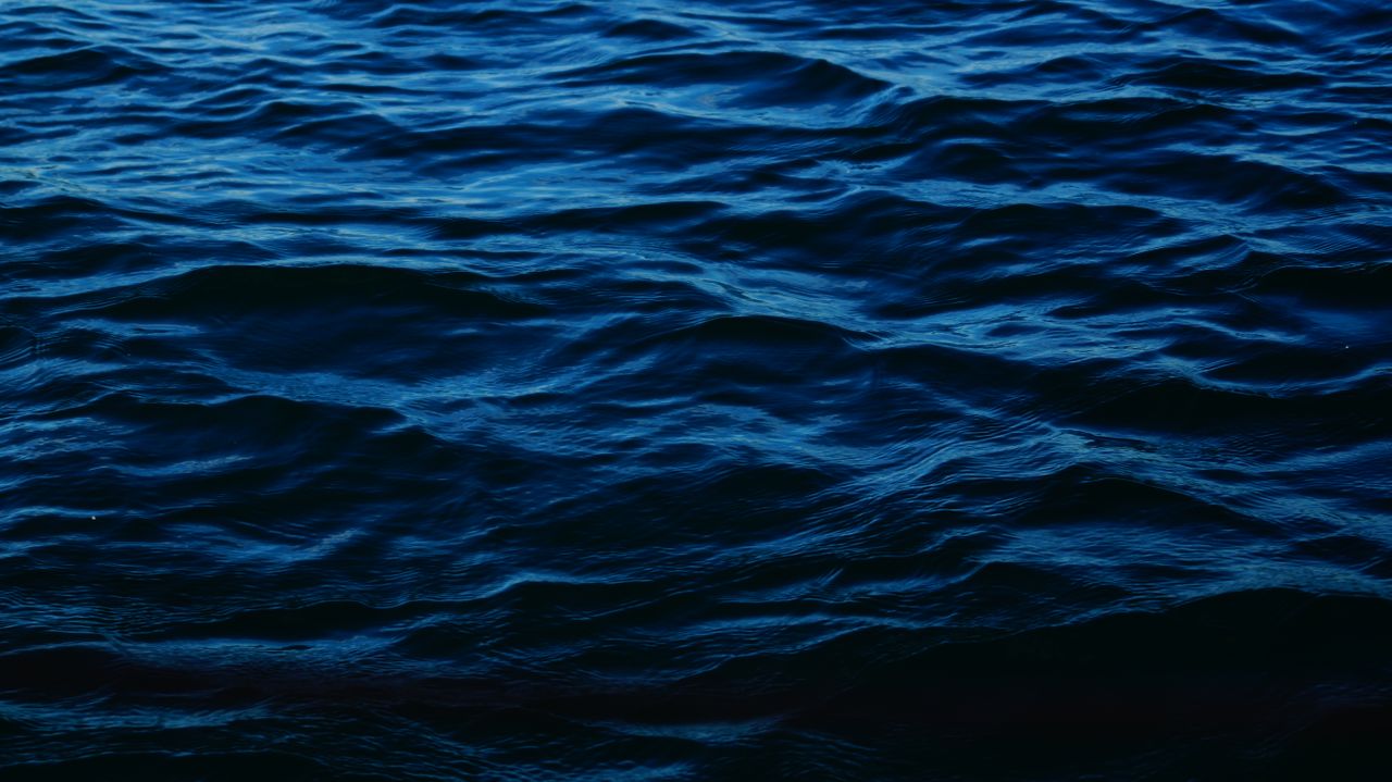 captivating image of blue ocean waves creating mesmerizing ripples and
