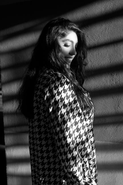 Stylish side-profile photo of a woman in monochrome with striking shadows. Captured in Iran.