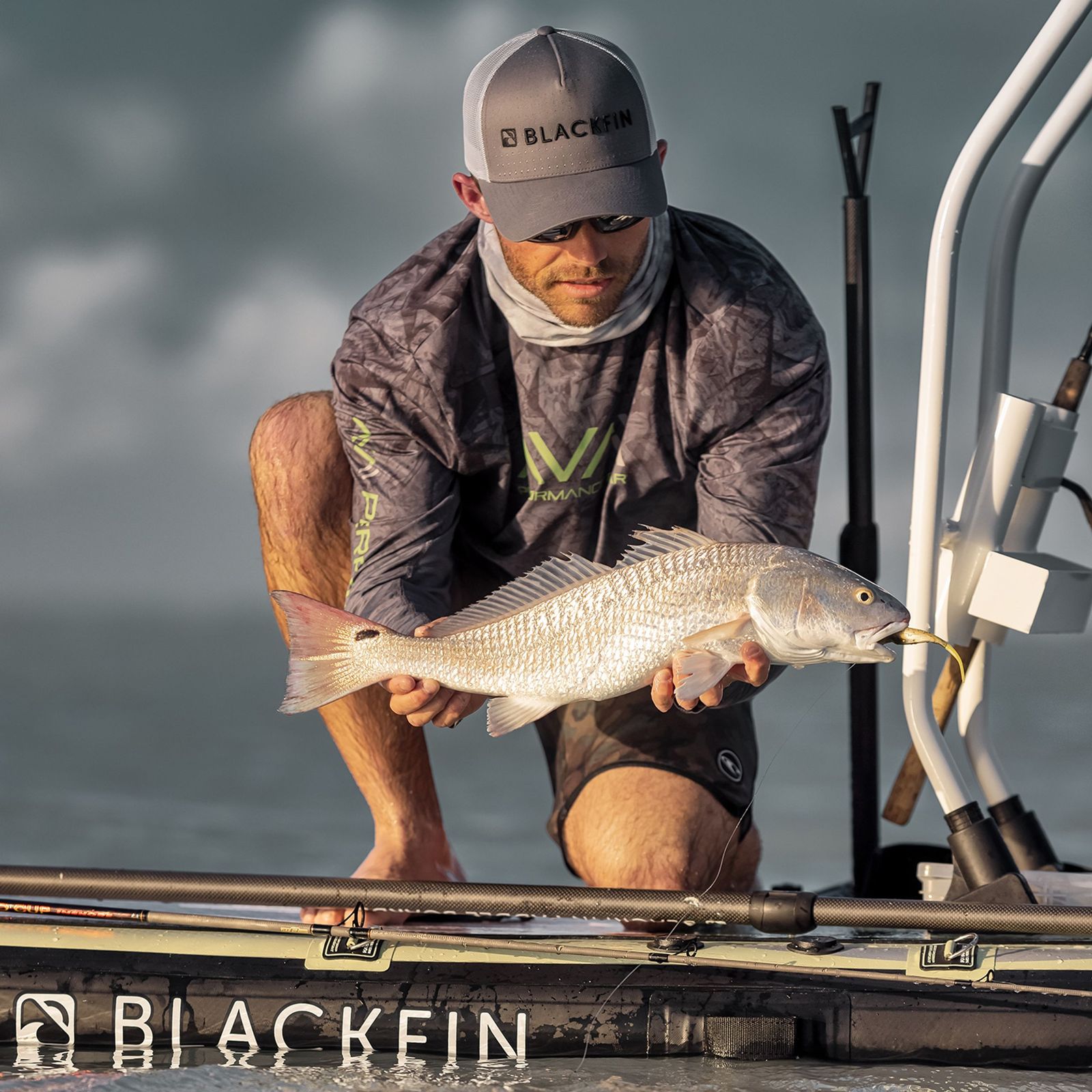 Angler holding up his catch during a group charter