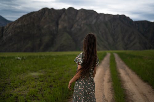 Back View of a Woman in Floral Dress