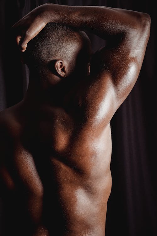 Back View of a Man Flexing his Muscle