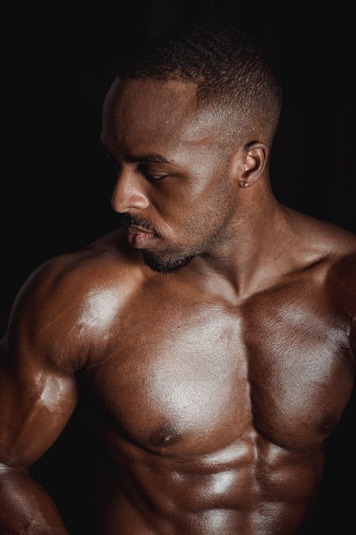 Free Powerful portrait of a fit, topless man showcasing strength and physique. Stock Photo