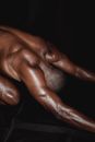 Persons Hand on Black Textile