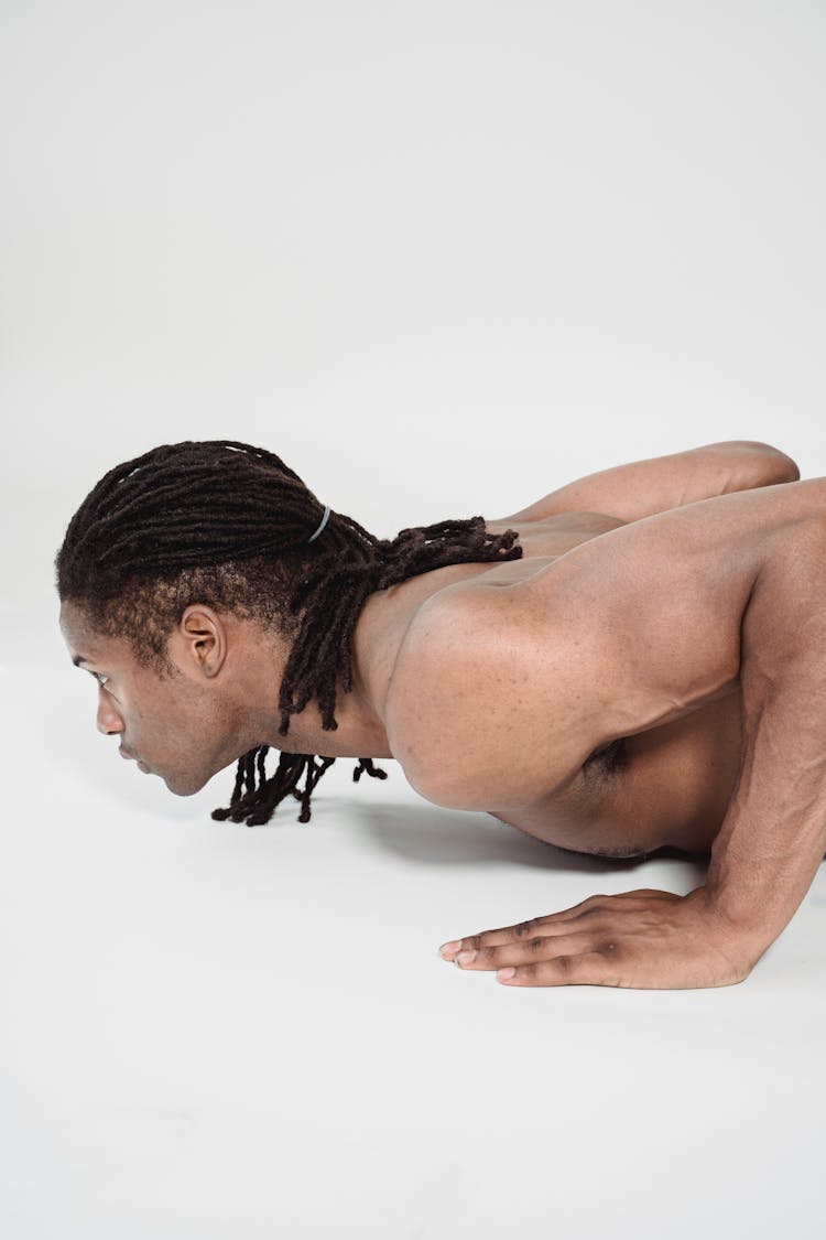 Muscular Shirtless Man On White Studio Background