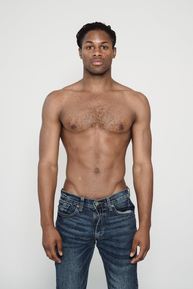 A Shirtless Man In Jeans