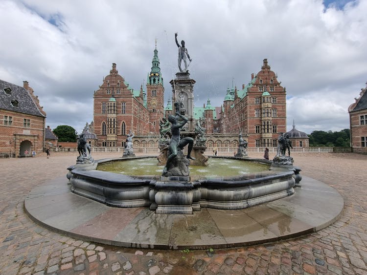 Neptune Fountain In Front Of The Frederiksborg Palace In Denmark