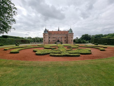 Explore the stunning gardens and architecture of Egeskov Castle in Denmark.