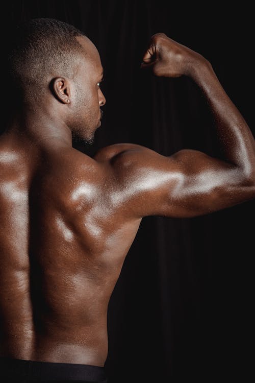 Free Muscular Man Flexing His Biceps Stock Photo