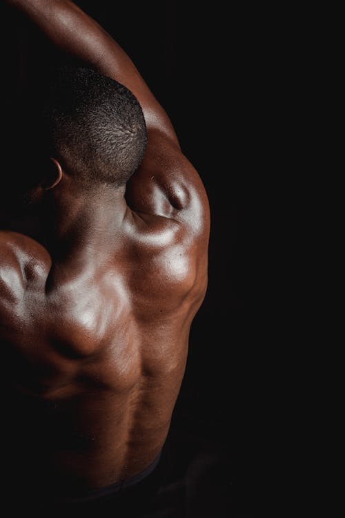 Man Flexing His Back Muscles