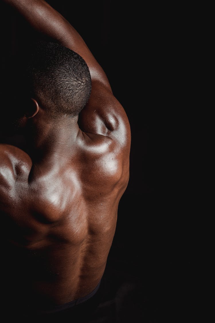 Man Flexing His Back Muscles