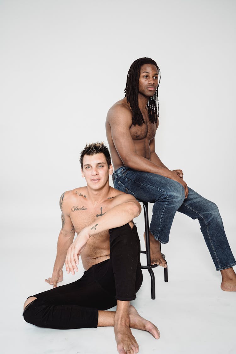 Men Posing On A Stool