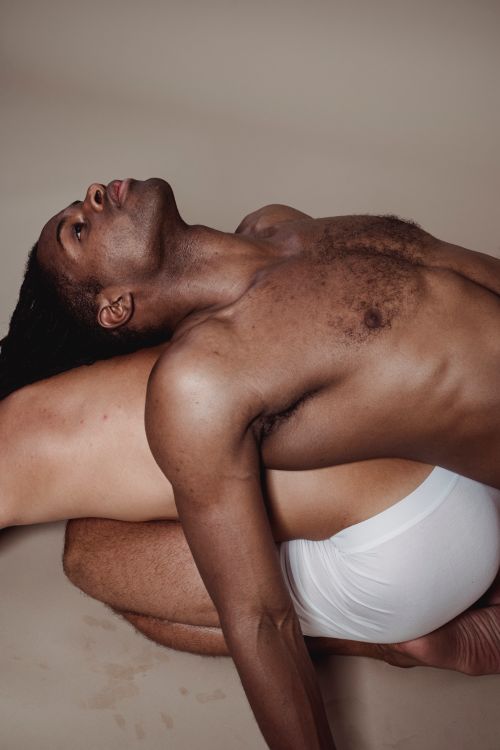 Free A striking studio portrait of a muscular man posing shirtless, emphasizing strength and masculinity. Stock Photo