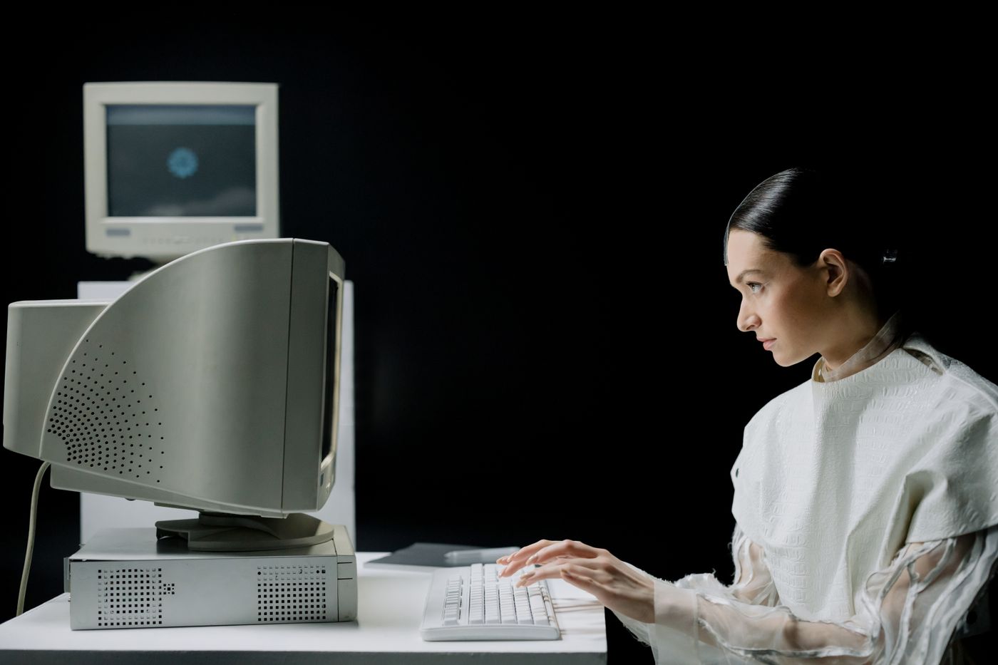 Person at an old desktop computer