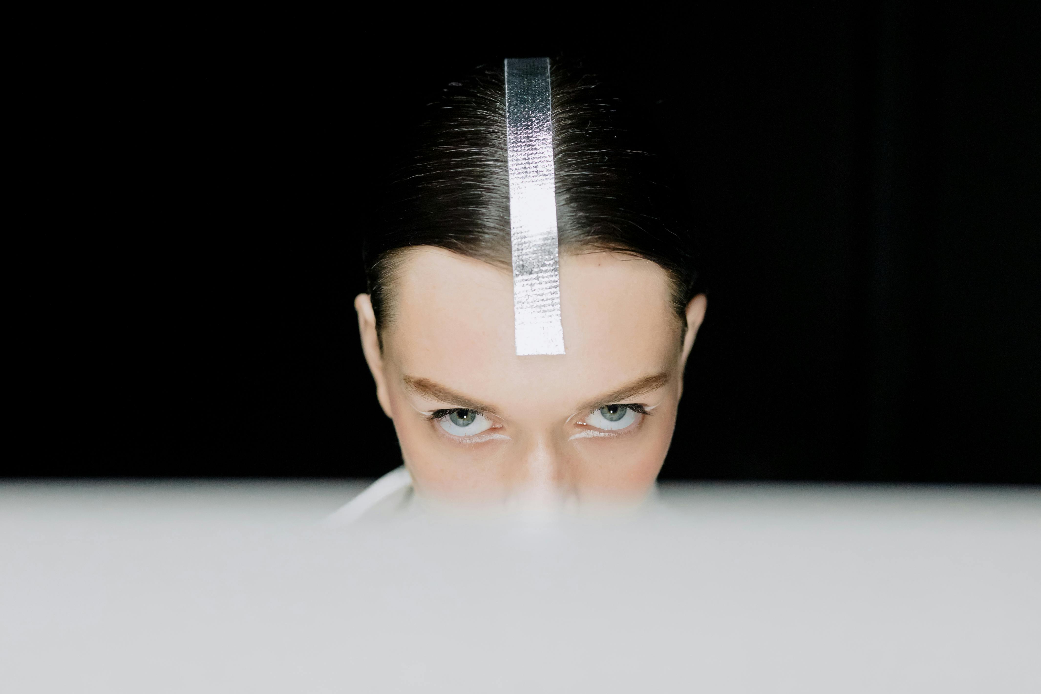 woman with silver tape on her hair