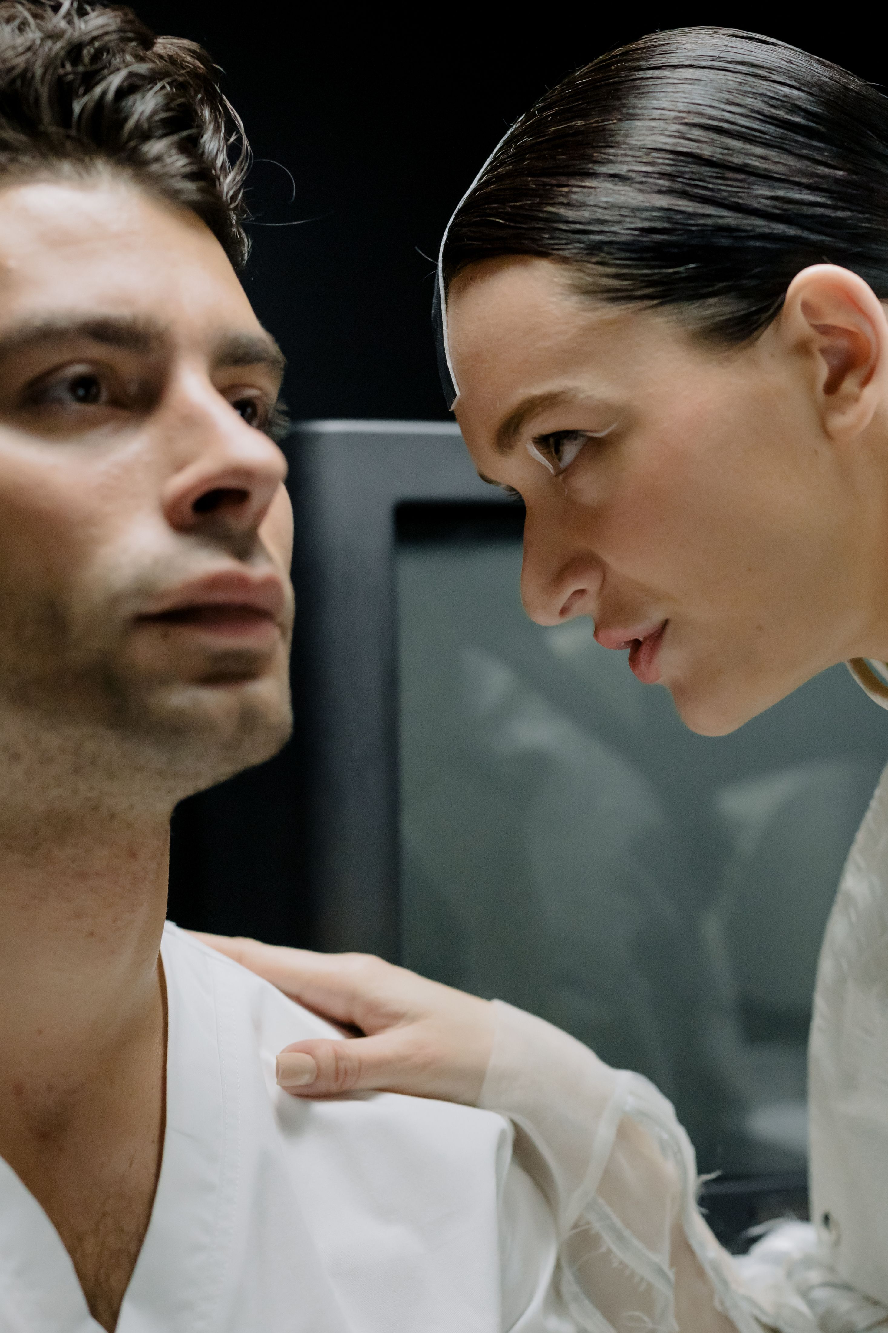 Focused medical professionals expressing seriousness during a critical discussion.