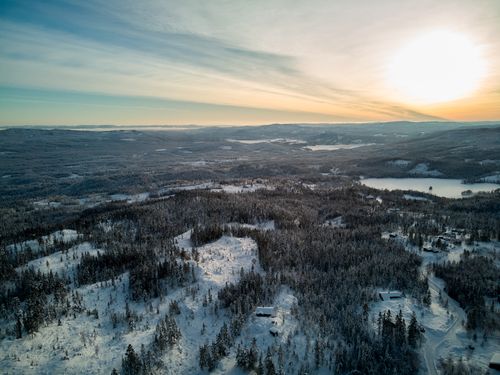 Free Stunning aerial view of snow-covered Krødsherad, Norway during winter at sunset. Stock Photo