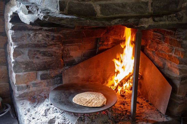 Flat Bread On Iron Plate And Fire In Stove