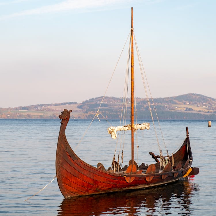 Photograph Of A Brown Wooden Sailboat