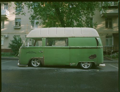 Free Retro green van with a classic design parked outdoors, showcasing vintage charm. Stock Photo