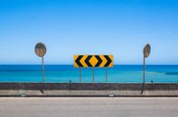 A Traffic Sign by the Seaside