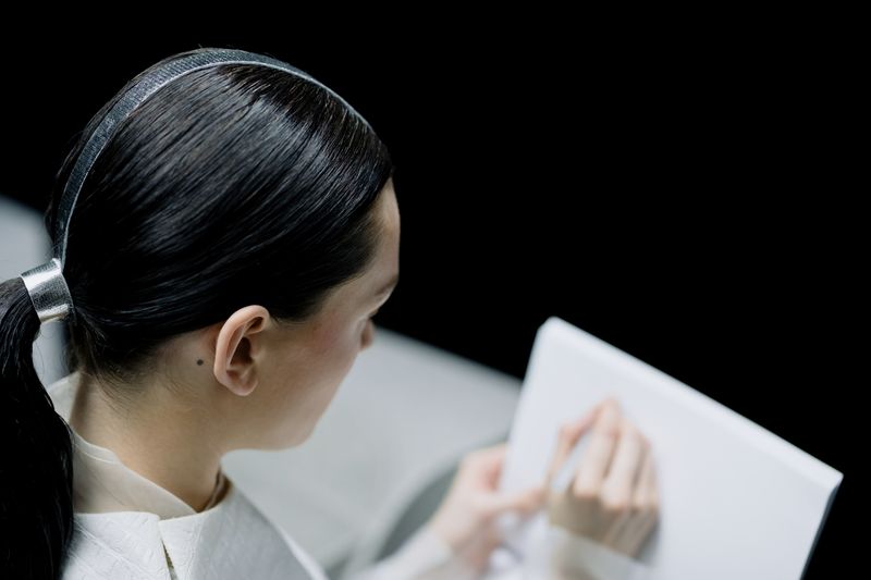 Woman with a sleek polished hairstyle