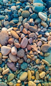 A vivid close-up of multi-colored pebbles on Batumi beach, showcasing natural beauty.
