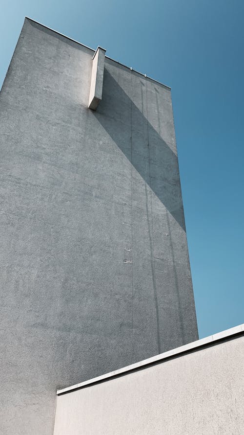 Free Gray Concrete Wall Under Blue Sky Stock Photo