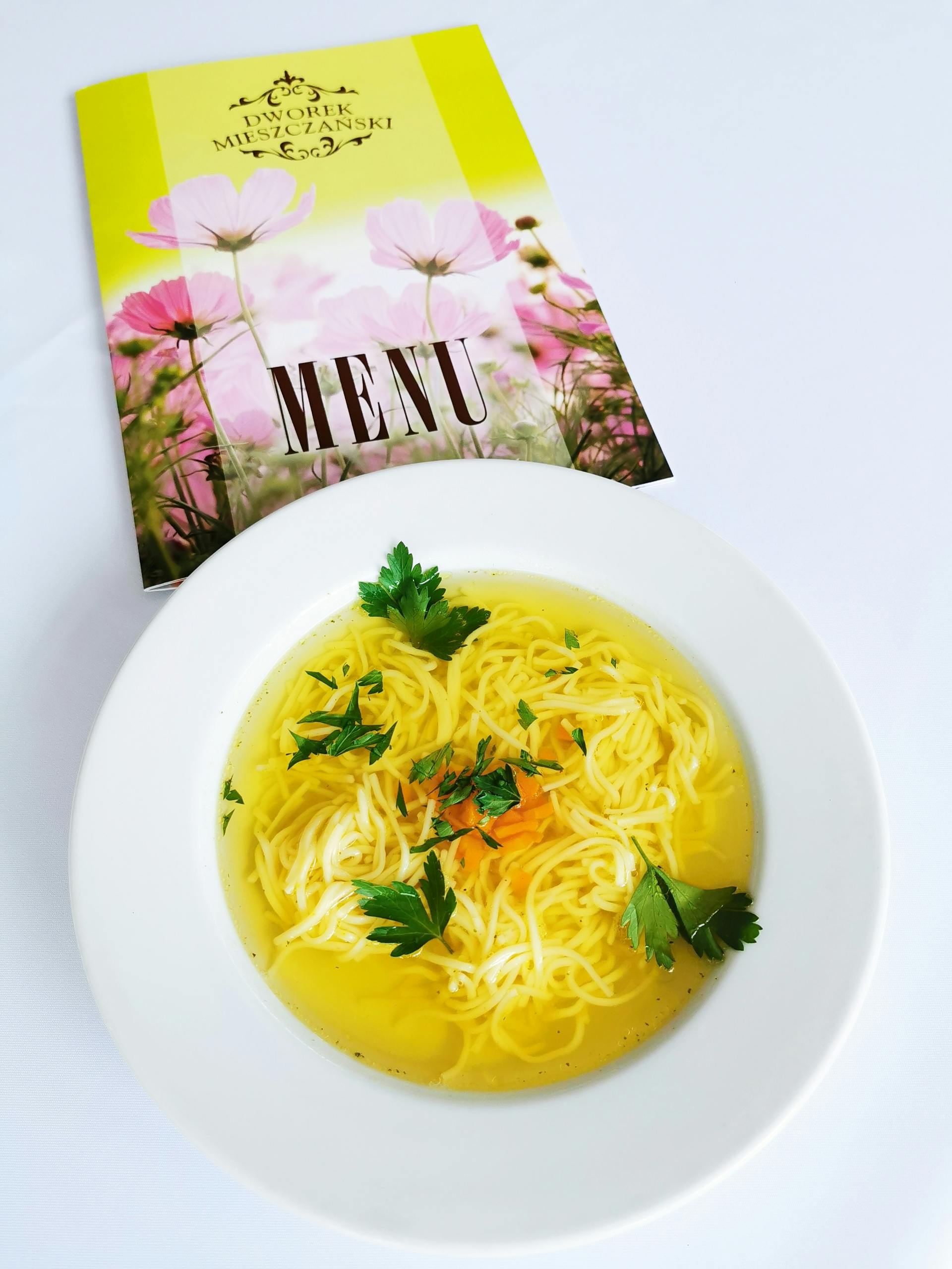 white ceramic bowl with noodles and soup