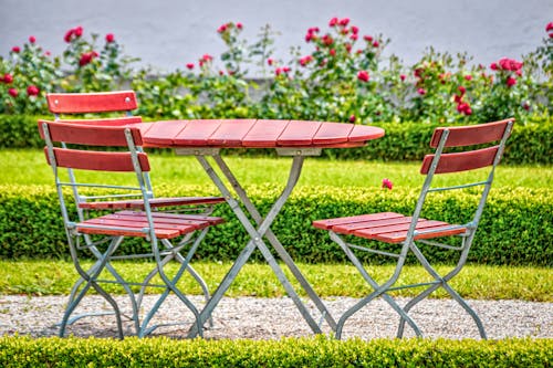 Free Close-up of a Table and Chairs in a Garden Stock Photo