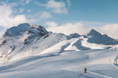 Free Person Walking On Snow Mountain Stock Photo