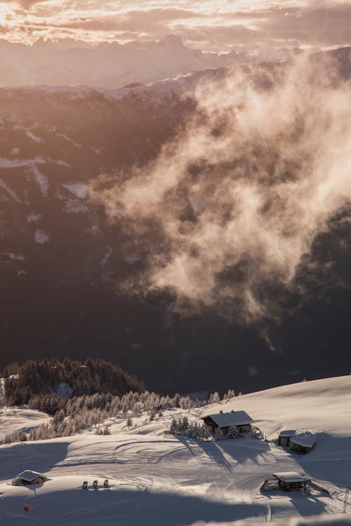 Aerial View of a Cottage on a Snowy Mountainside