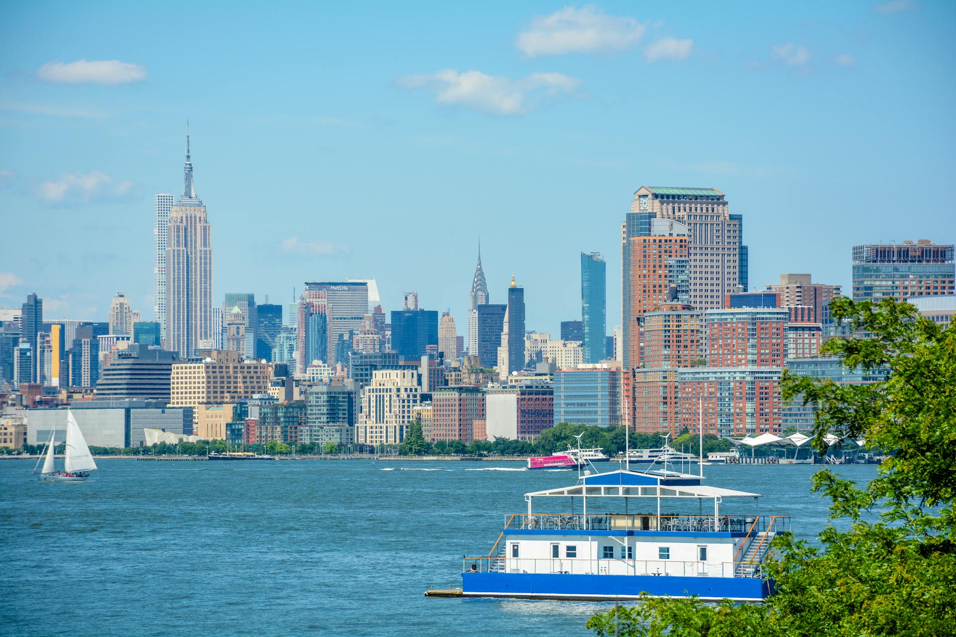 Stunning New York City skyline view with iconic landmarks like the Empire State and Chrysler Buildings.