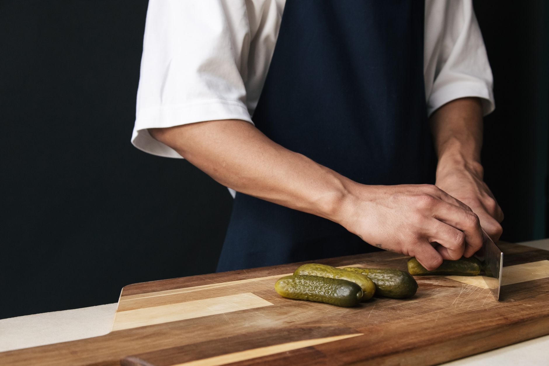 Golden fried pickles on a plate with dipping sauce