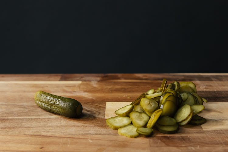 Delicious Fresh Pickles On A Wooden Chopping Board