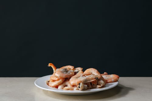 Close-Up Photo of Shrimps in a White Plate