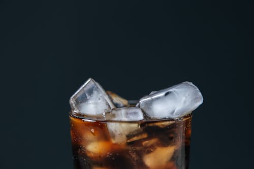 Close-Up Shot of a Soft Drink with Ice Cubes 